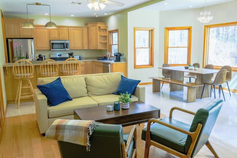 This cozy cabin features multiple seating areas, perfect for family gatherings after a day of adventure.