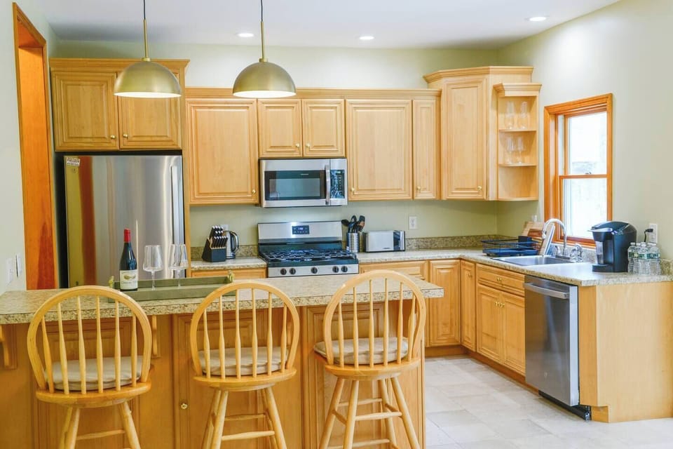 The main level features a gourmet kitchen, ideal for cooking together and creating unforgettable meals.