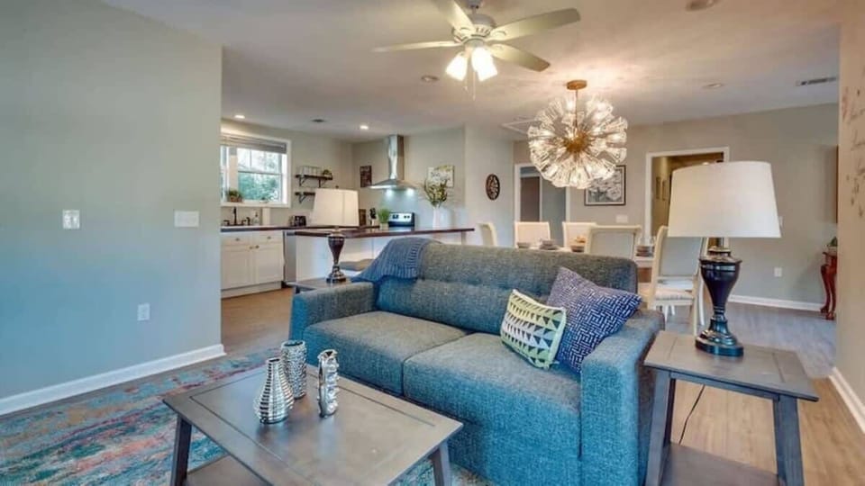 A comfortable living room featuring blue accents and modern furniture.