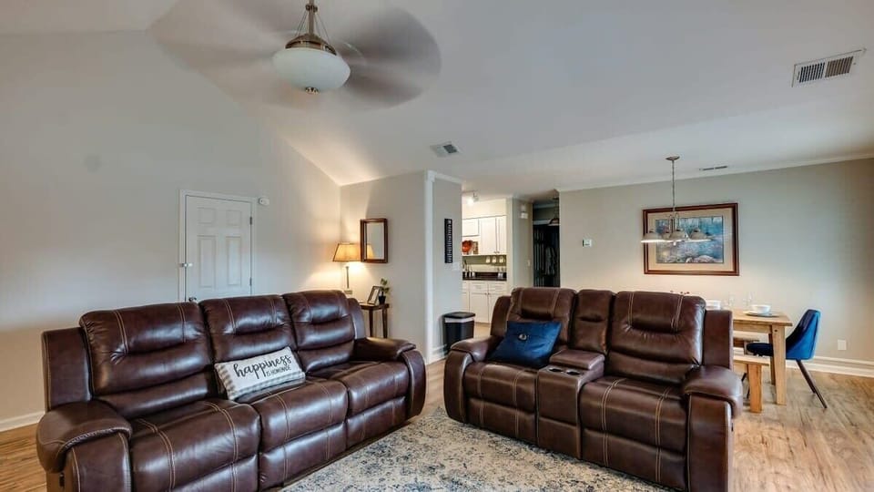 Comfortable living room with leather recliners and modern furnishings.