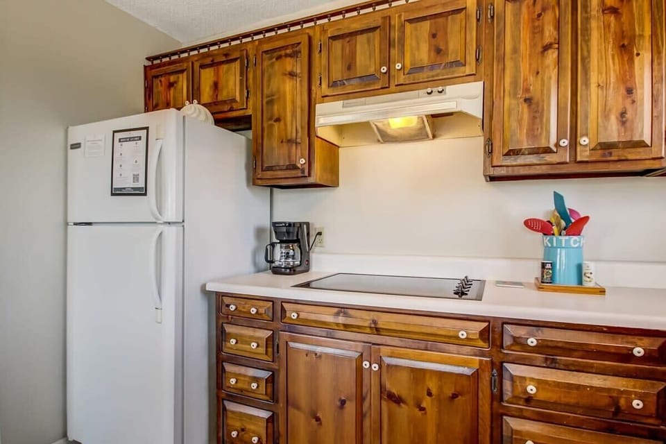 Kitchen detail showing custom cabinetry and plenty of storage space.