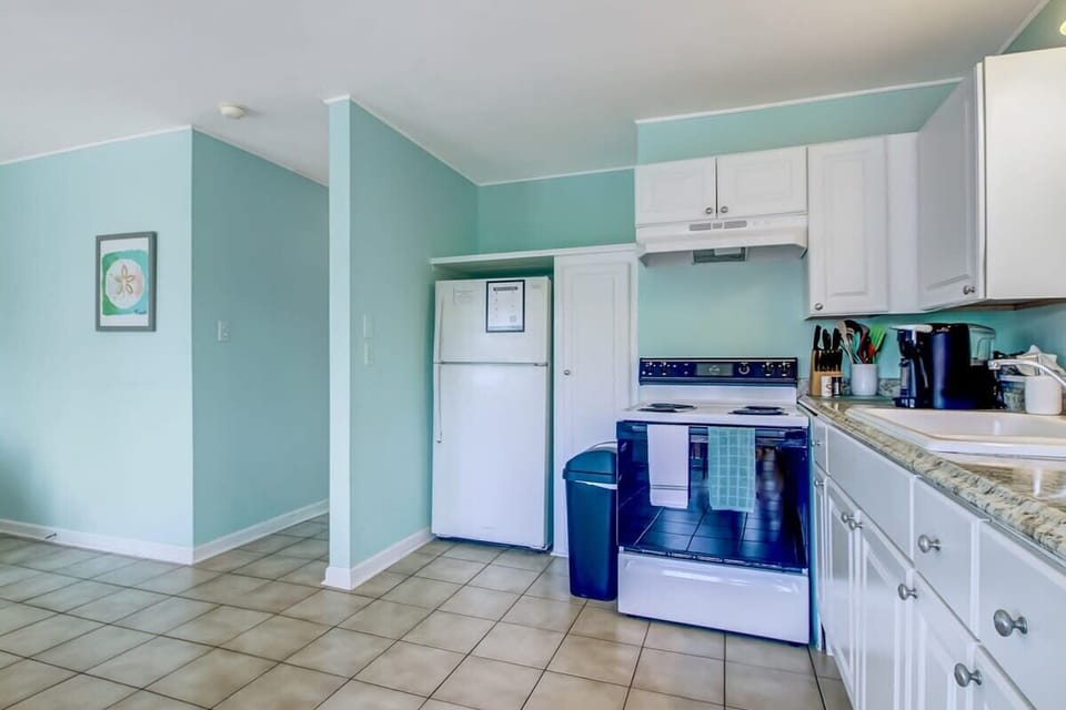Kitchen equipped with a fridge to store your fresh groceries.