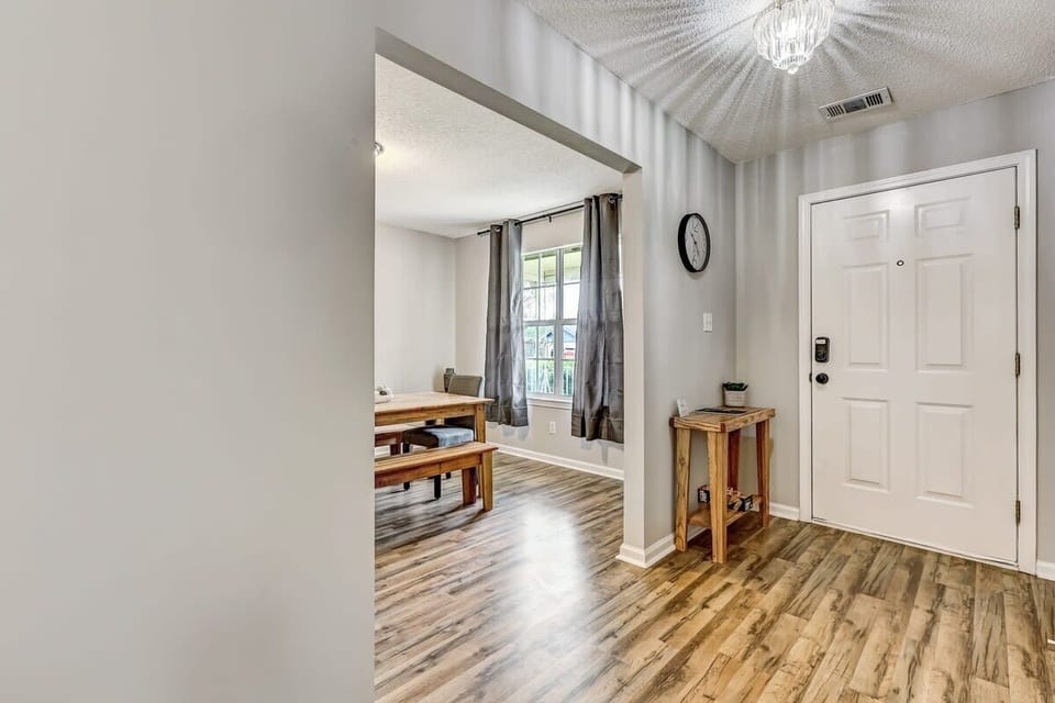 Entryway and hallway view offering a simple, open flow through the home.