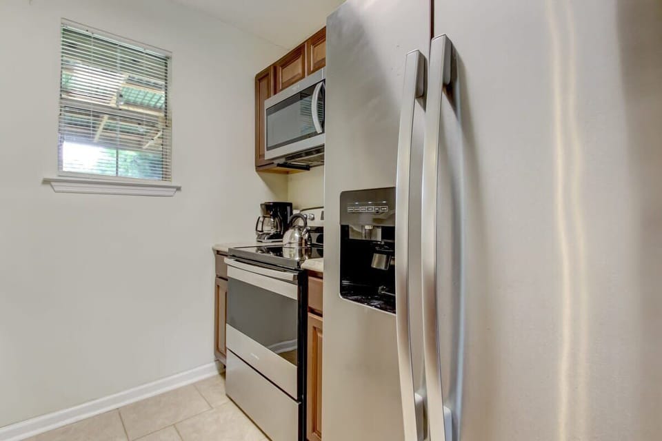 Full-size stainless steel refrigerator and stove included for your convenience.