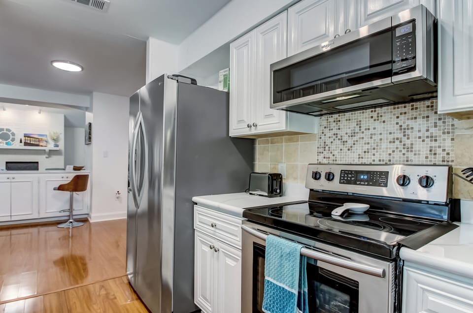 Well-equipped galley kitchen with modern appliances and ample storage.