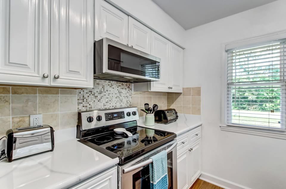 Bright, fully equipped kitchen with everything you need for preparing meals during your stay.