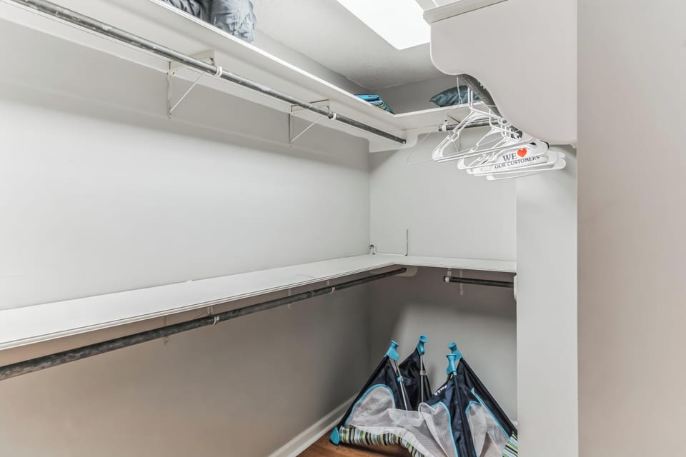 A neatly organized closet space with hanging storage for longer stays.