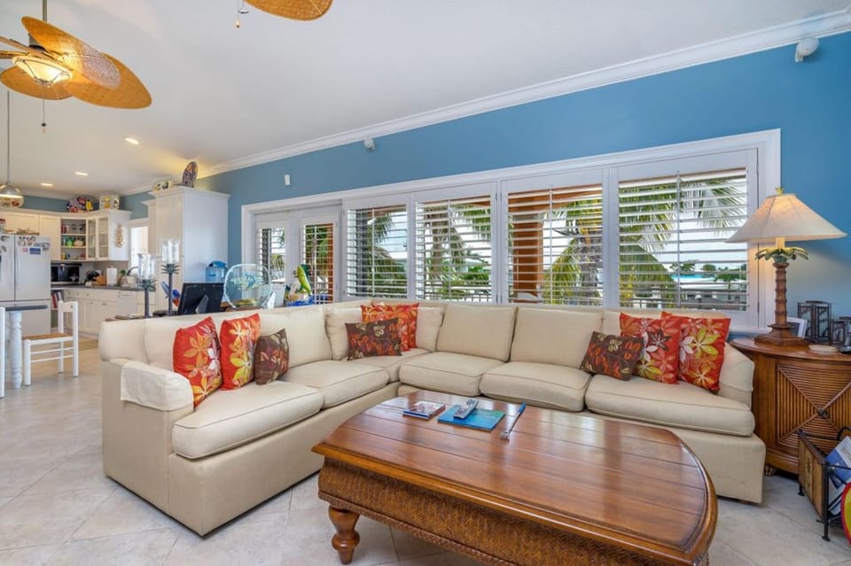 Comfortable living room with beautiful waterfront views and smart TV