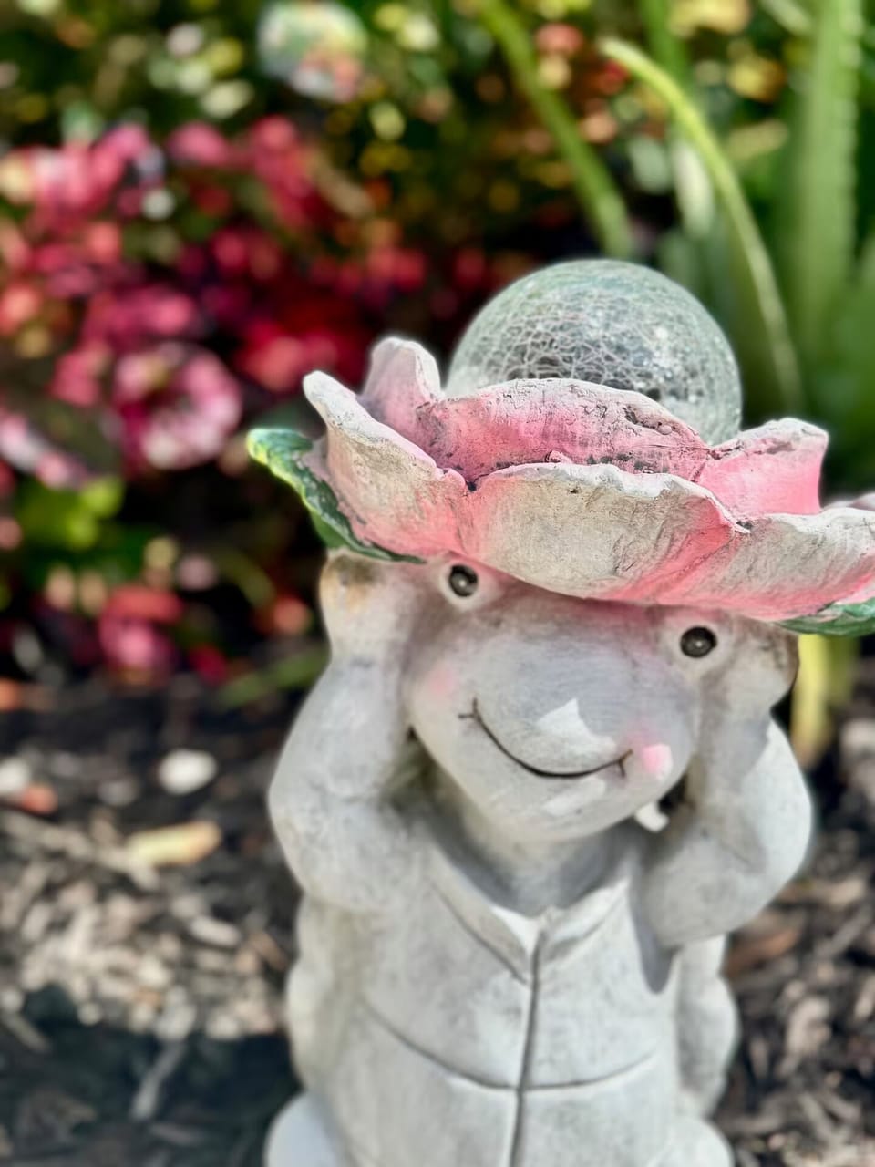 Delight in the whimsical garden décor sprinkled throughout the space.