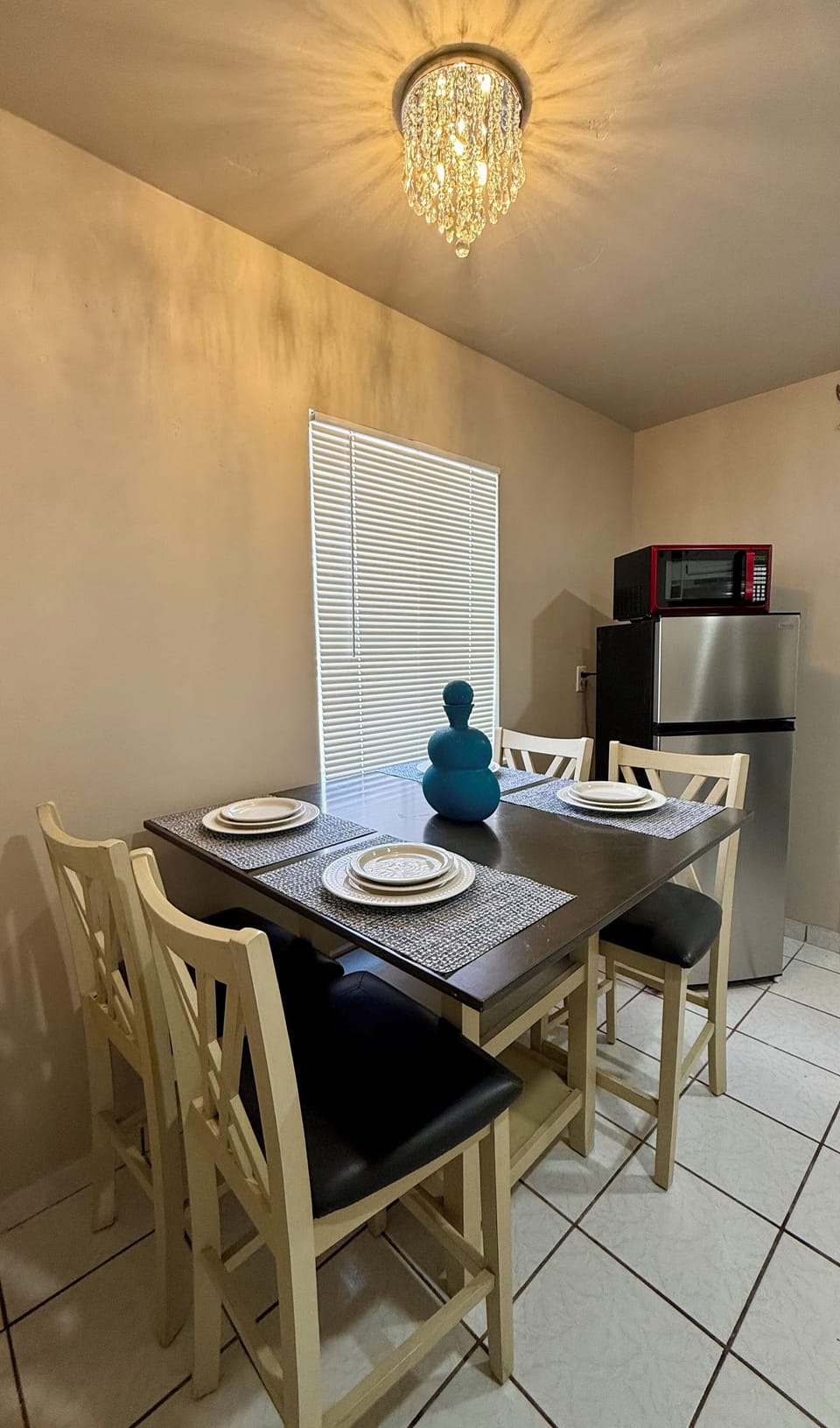 Natural light from the window creates a warm, welcoming vibe to enjoy meals.