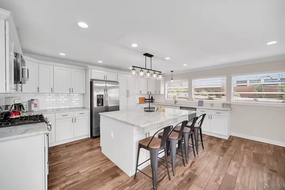Fully equipped kitchen with stainless steel appliances & huge kitchen island