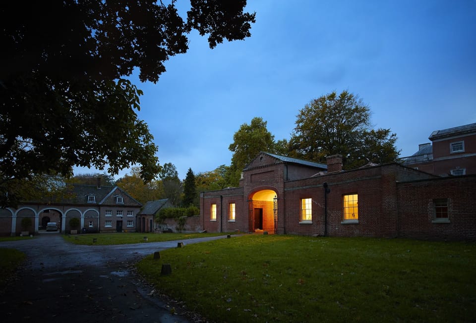 Former gate house with Stewards House on the right-hand side by twilight
