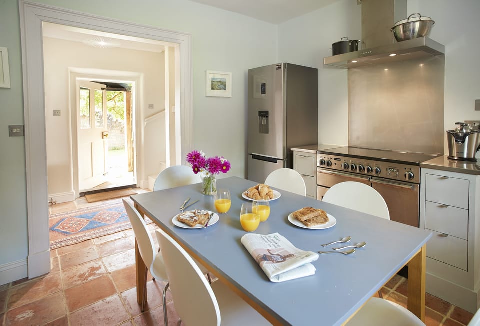 Dining area in the kitchen with table seating six guests