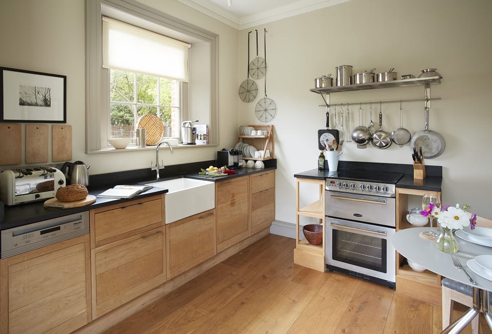 Well-equipped kitchen with solid oak worktops and miele appliances