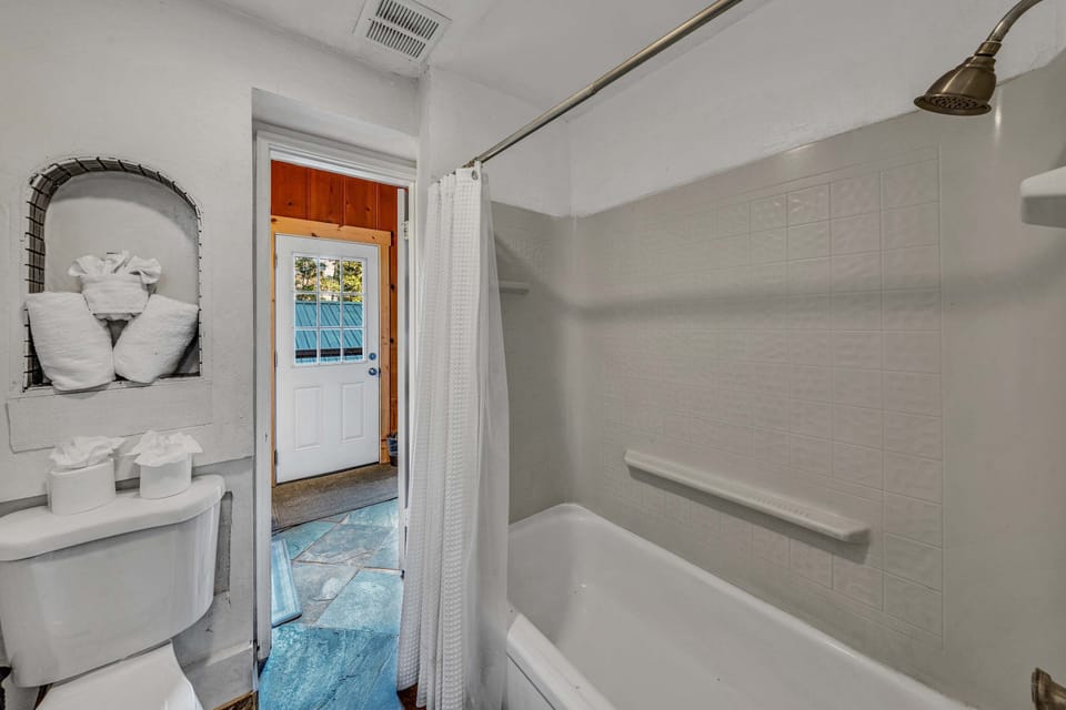 Bathroom 1 (main floor): Shower-tub combo