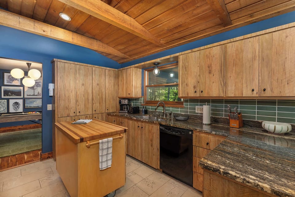 Features high-end appliances and a spacious island—perfect for meal prep, casual dining, or gathering with friends and family.