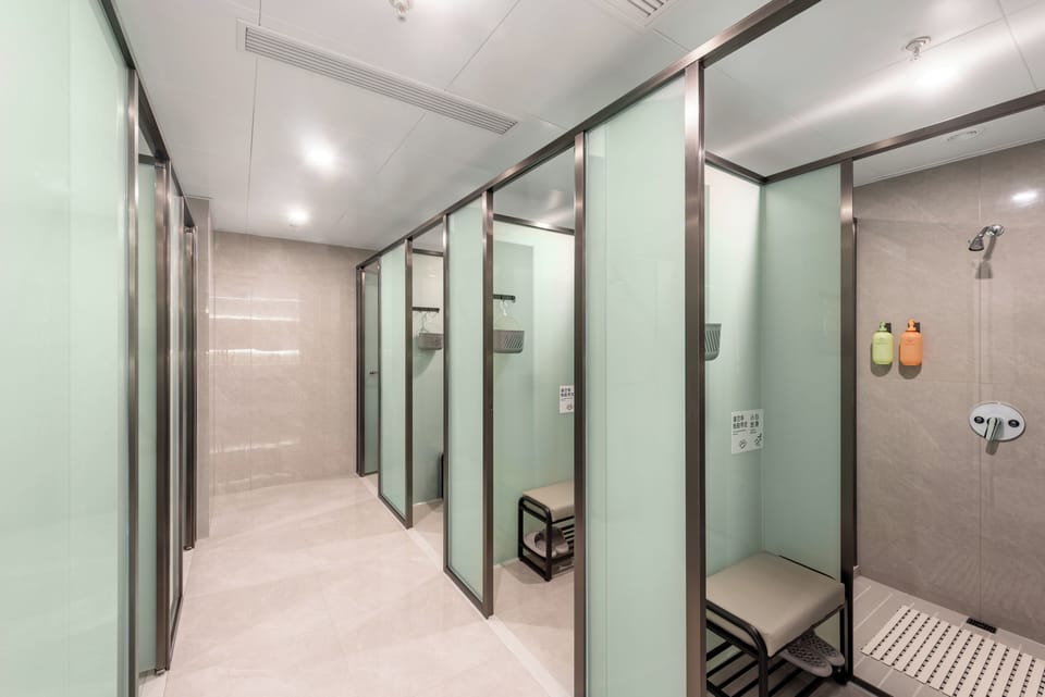 Shower, hair dryer, towels, shampoo