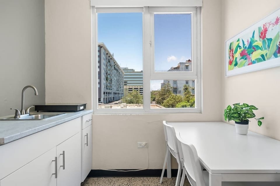 Enjoy the convenience of a dedicated desk area with a mini-fridge and a toaster, perfect for preparing light meals, snacks, or keeping your beverages chilled during your stay.