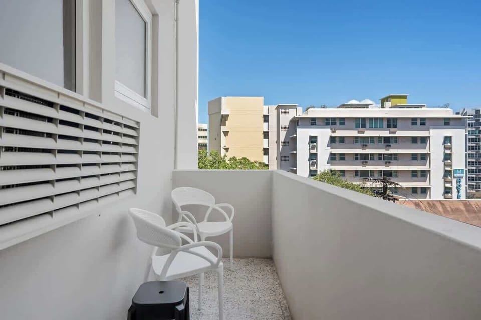 Enjoy the lively cityscape from your private balcony! It's the perfect spot to sip your morning coffee or unwind with an evening drink while taking in the views.