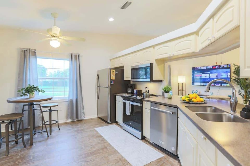 Cook up your favorite meals in a modern kitchen stocked with all the essentials—cookware, dishes, utensils, and more—perfect for long stays or family dinners.