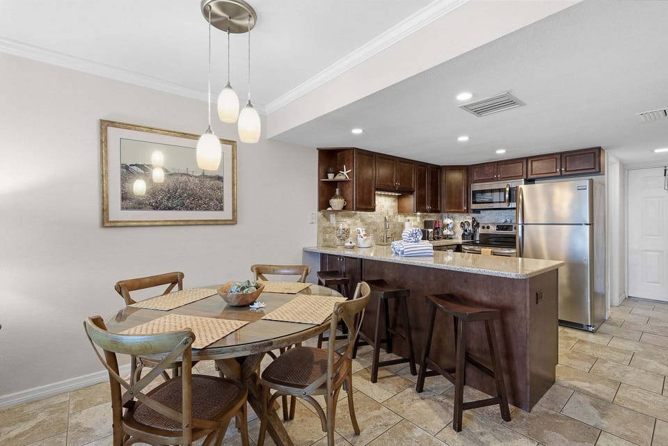 Enjoy a stylish open dining area and fully equipped kitchen perfect for family meals after a day at the beach. This inviting beach stay offers comfort, convenience, and a relaxing coastal atmosphere.