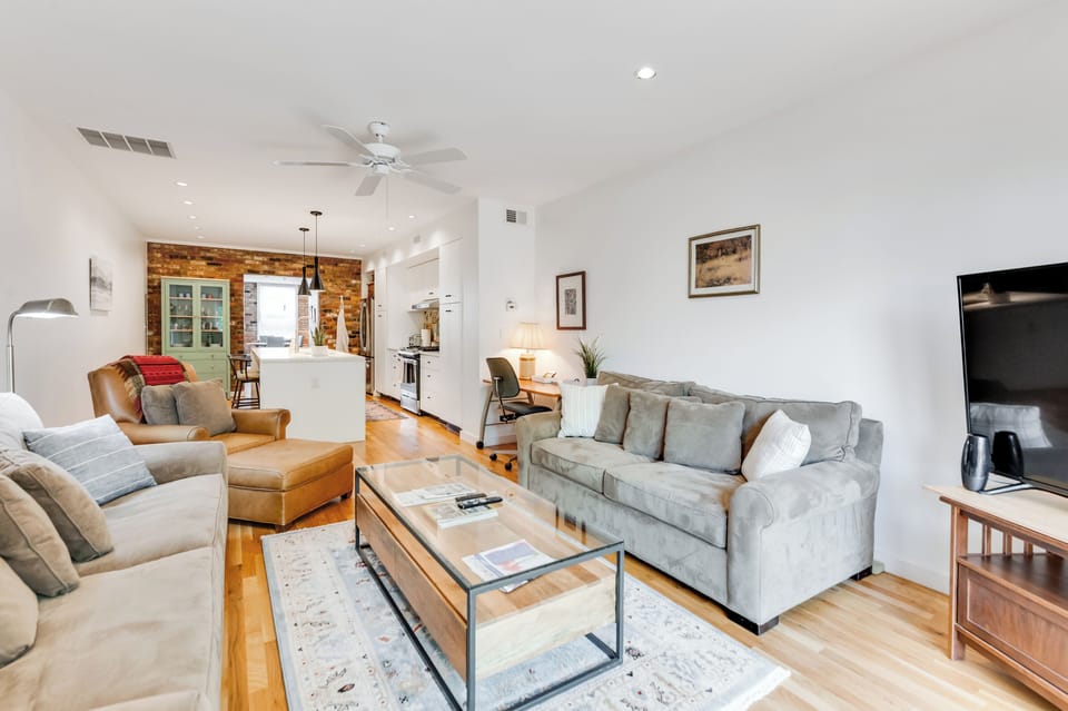 Living Room: Stylish retreat with sleek furnishings and a pop of rustic charm, perfect for entertaining!