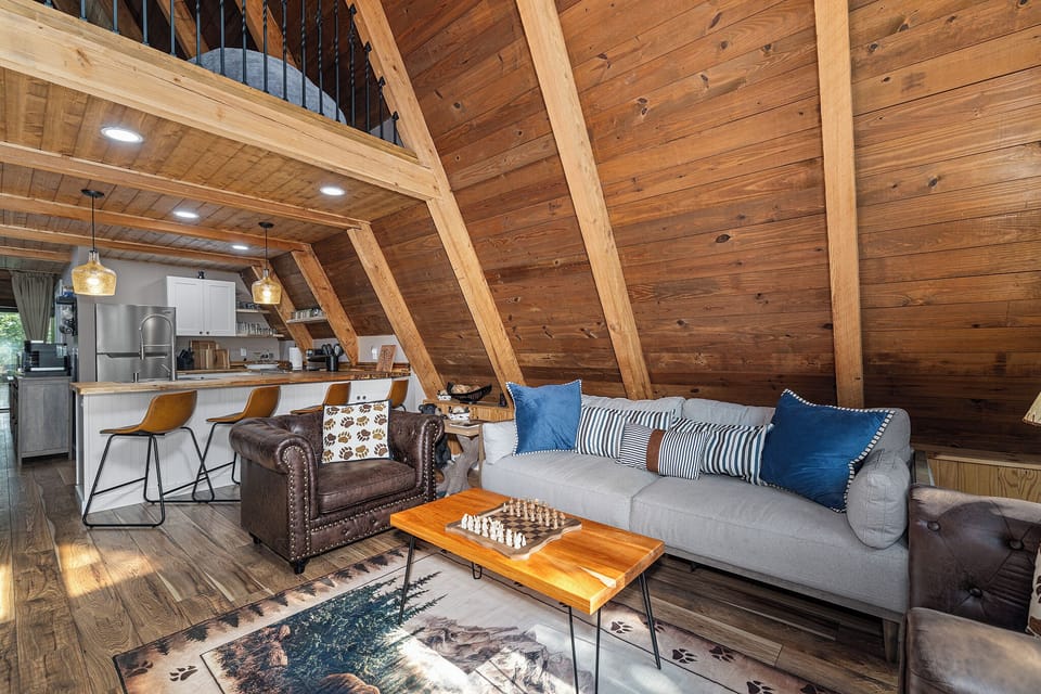 Warm, woodsy living room where game nights and laughter happen.