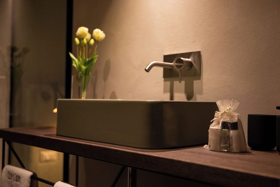 Shower, rainfall showerhead, hair dryer, towels