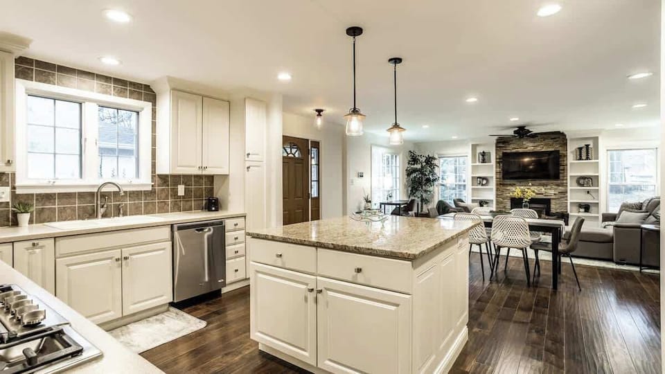 look from family room back towards kitchen/island/living room