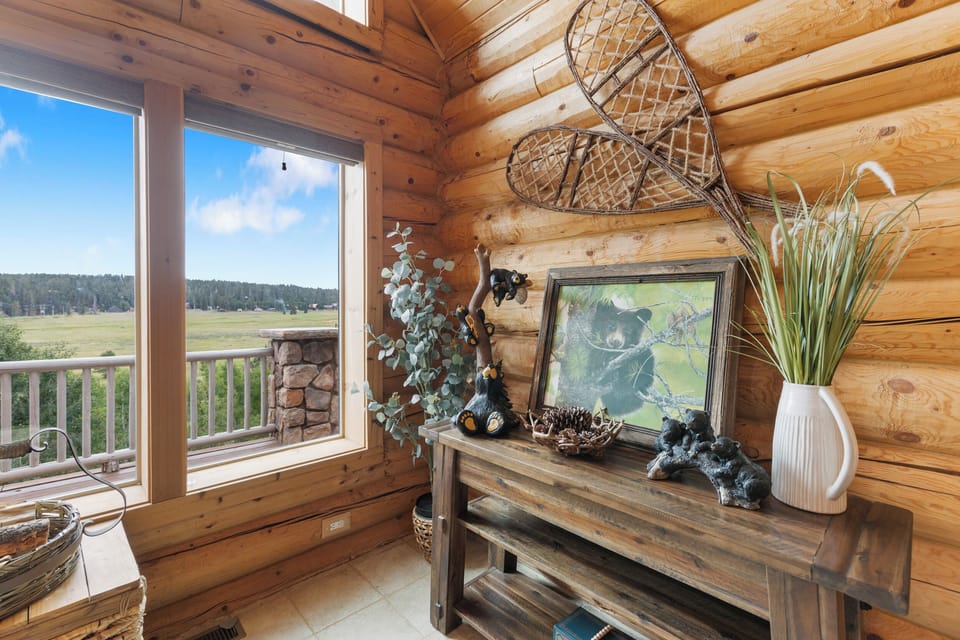 View from front windows of the cabin overlooking meadow 