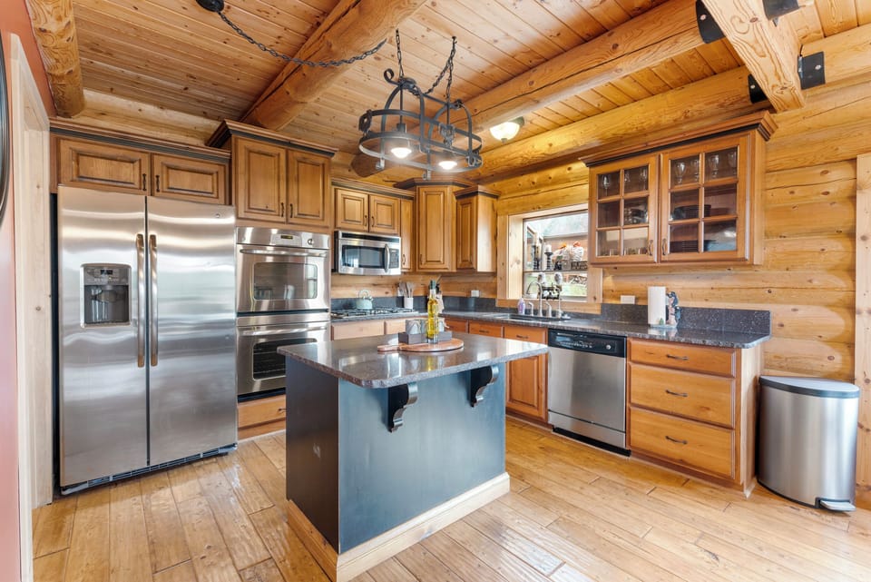 Kitchen with stainless appliances and kitchen island. 