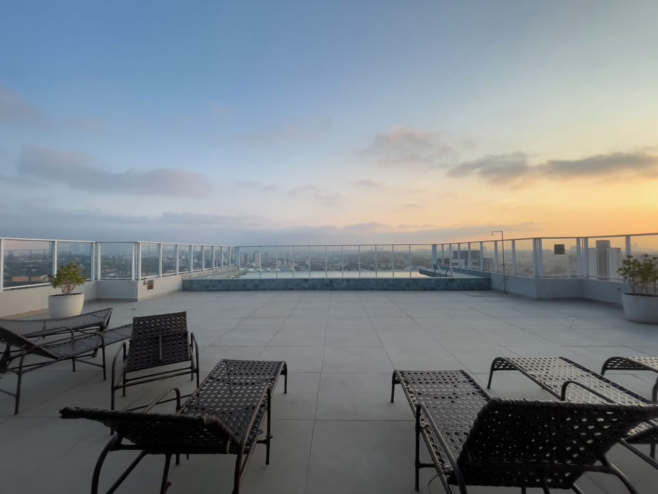 Outdoor pool, open 7:00 AM to 10:00 PM, pool umbrellas