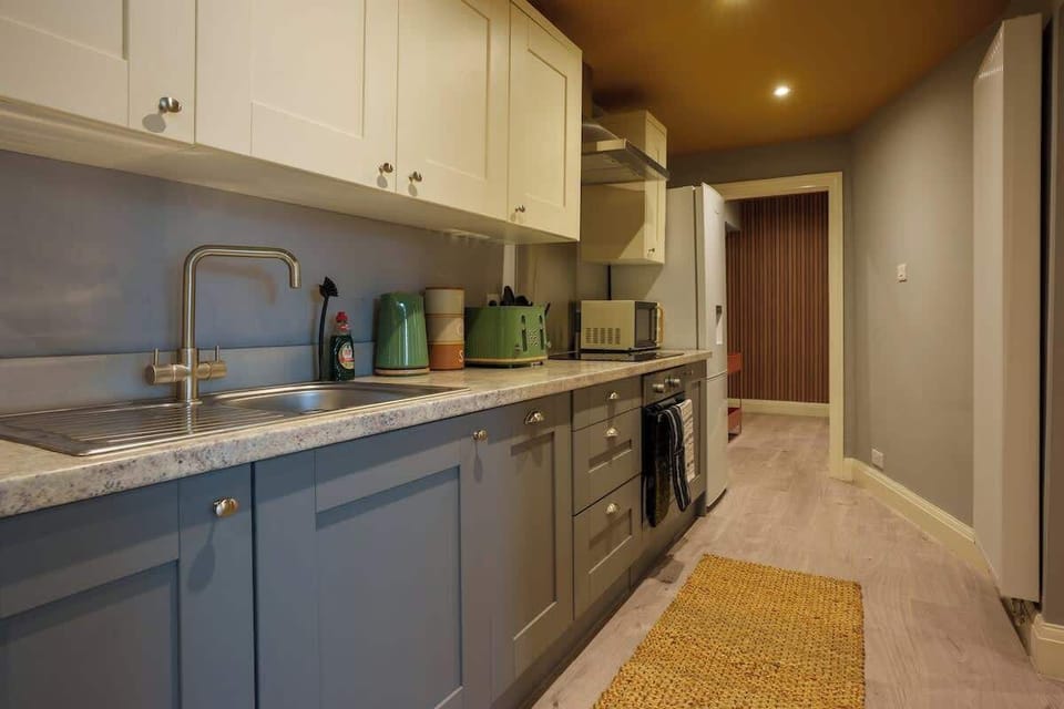 A full kitchen includes all the essential appliances and fixtures needed for cooking, preparing, and storing food.