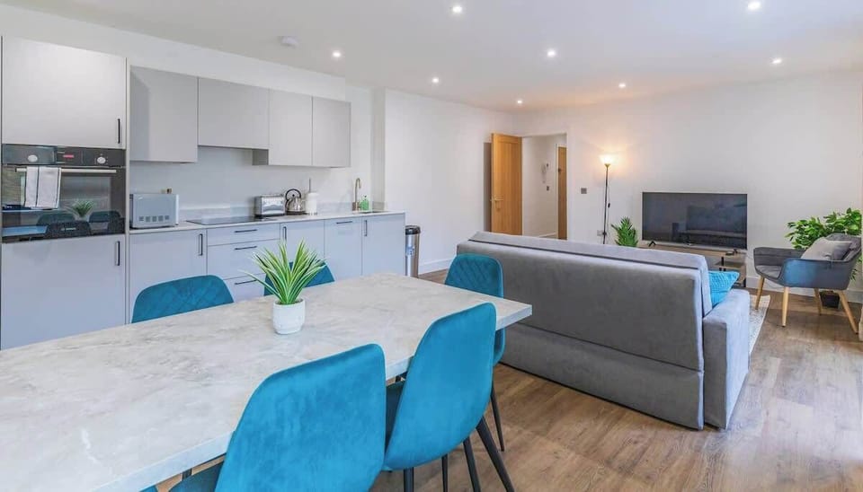 An elegant dining area with a stylish table, comfortable chairs, and ambient lighting, perfect for meals and gatherings.