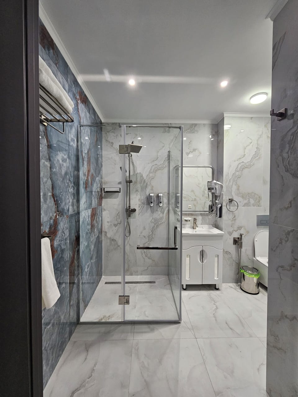 Shower, free toiletries, hair dryer, slippers