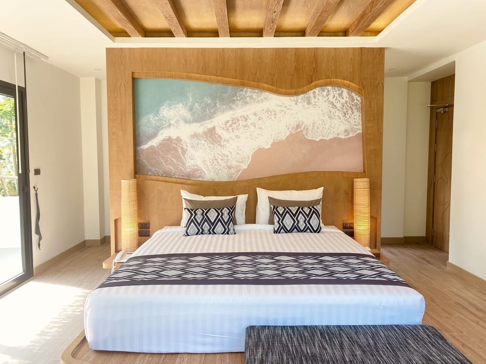 Junior Suite, Pool View | Minibar, in-room safe, individually decorated, individually furnished