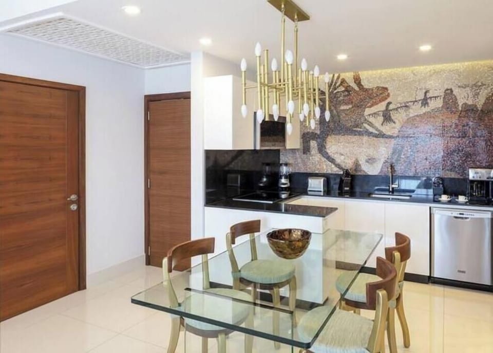 Bright and spacious common areas inside the suite, washer and dryer machine 