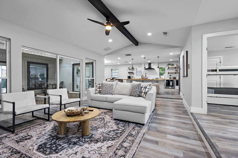 Gorgeous living room opens to gourmet kitchen.