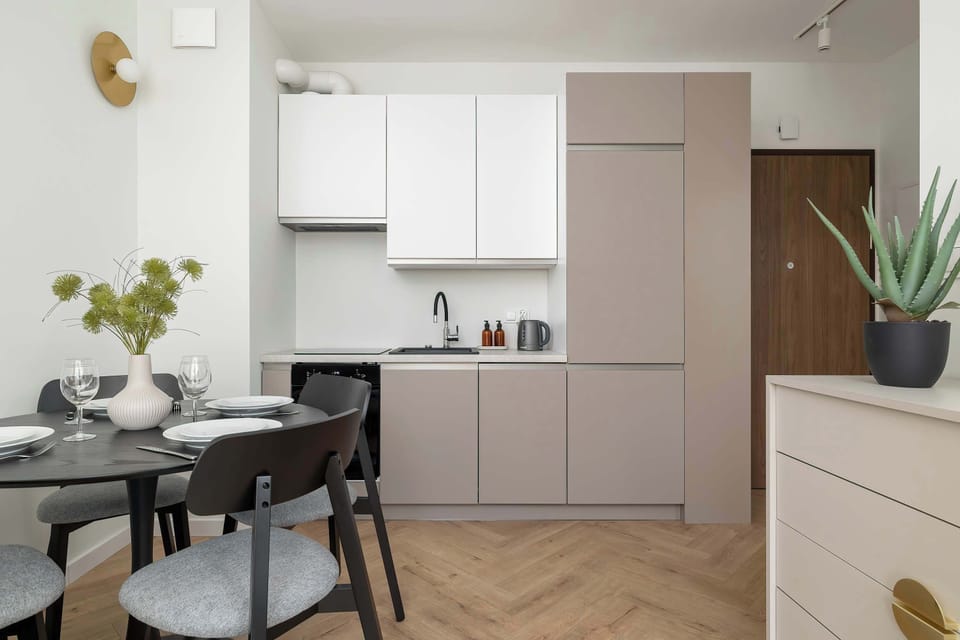 Another view of the kitchenette showcasing its functionality and sleek design.