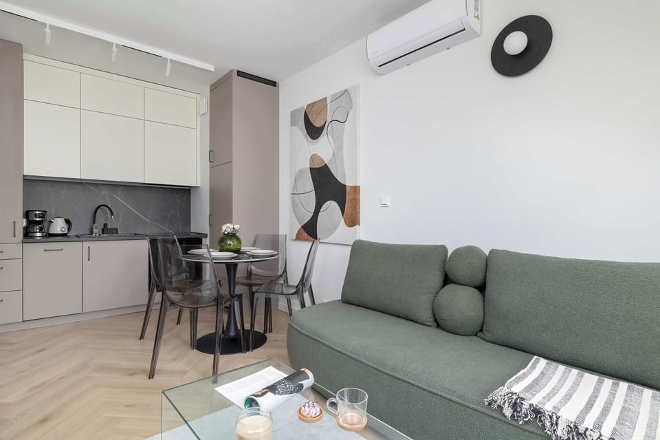 Living room with modern television with cable channels, which allows the guests to enjoy their favourite programs.