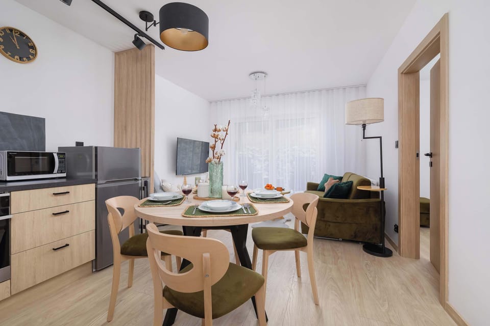 Fully equipped kitchenette with dining area and living room.