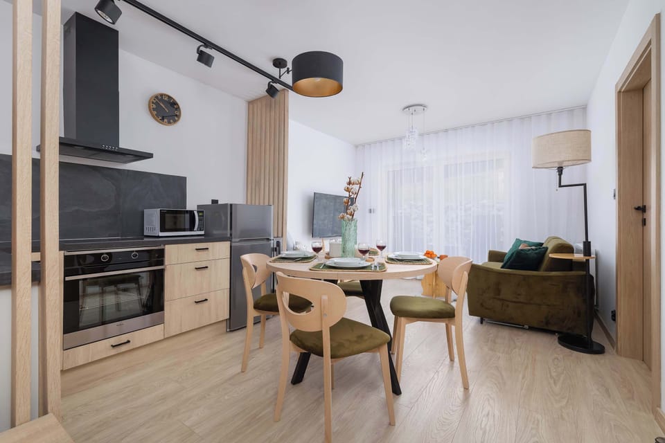 Fully equipped kitchenette with spacious dining area and living room.