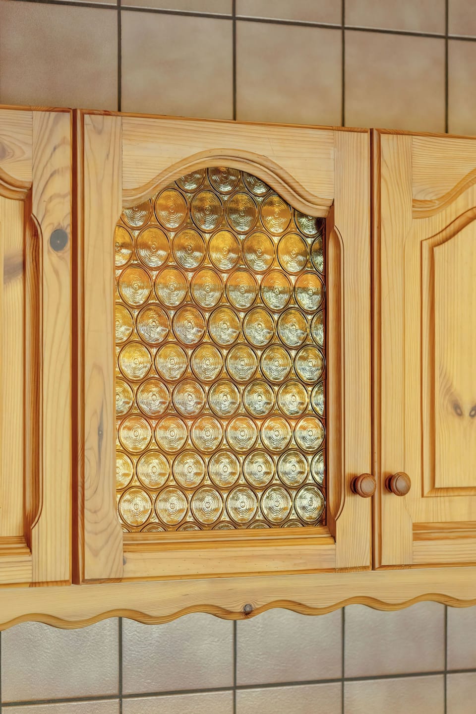 Close-up of the wooden kitchen cabinets.