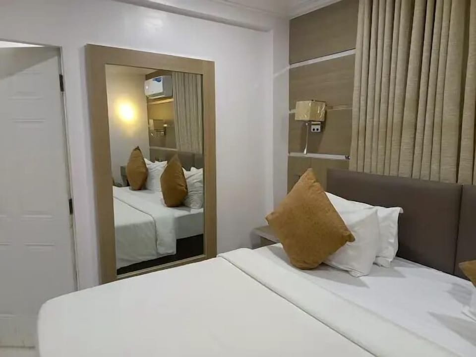 Deluxe Room, Balcony, City View | Desk, laptop workspace, blackout drapes, soundproofing