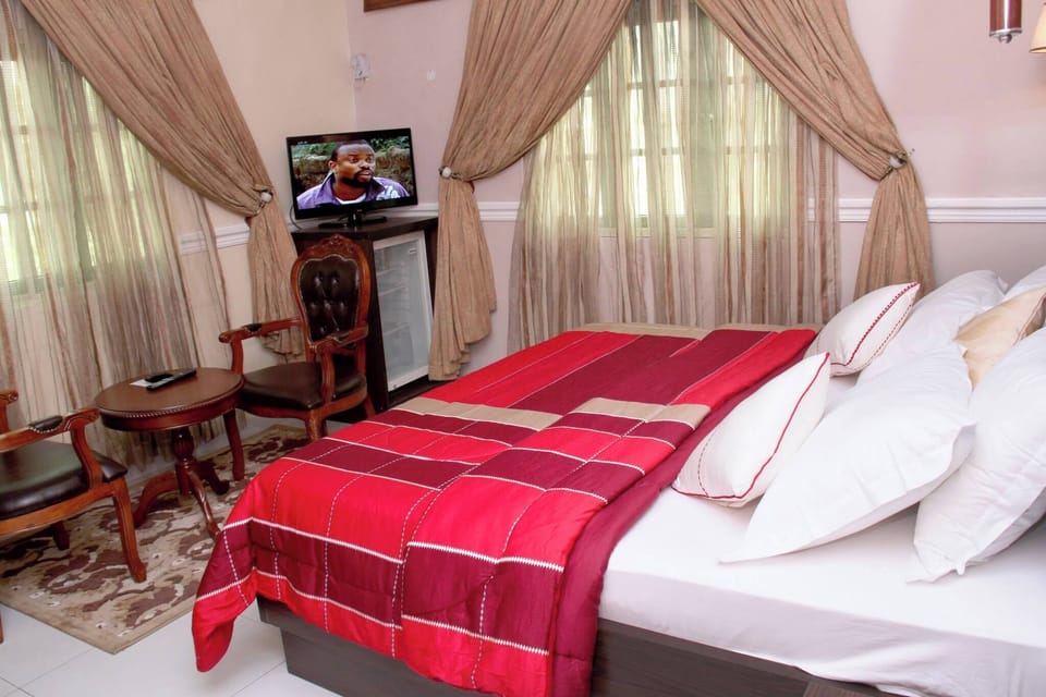 Deluxe Room, Balcony, City View | Desk, laptop workspace, blackout drapes, soundproofing