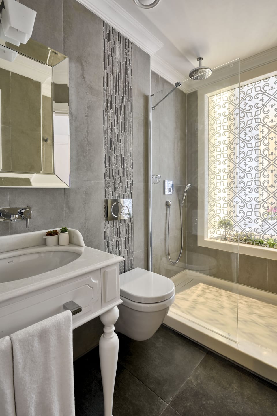 Shower, designer toiletries, hair dryer, slippers