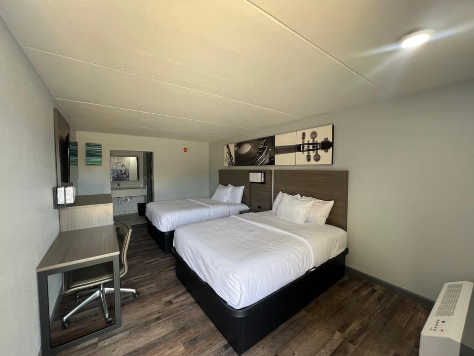 Premium bedding, desk, laptop workspace, free WiFi