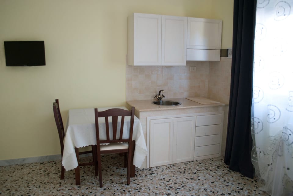 Quadruple Room, Kitchenette | Private kitchen | Fridge