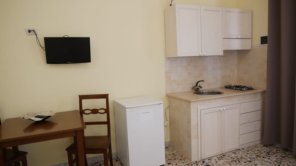Quadruple Room | Private kitchen | Fridge