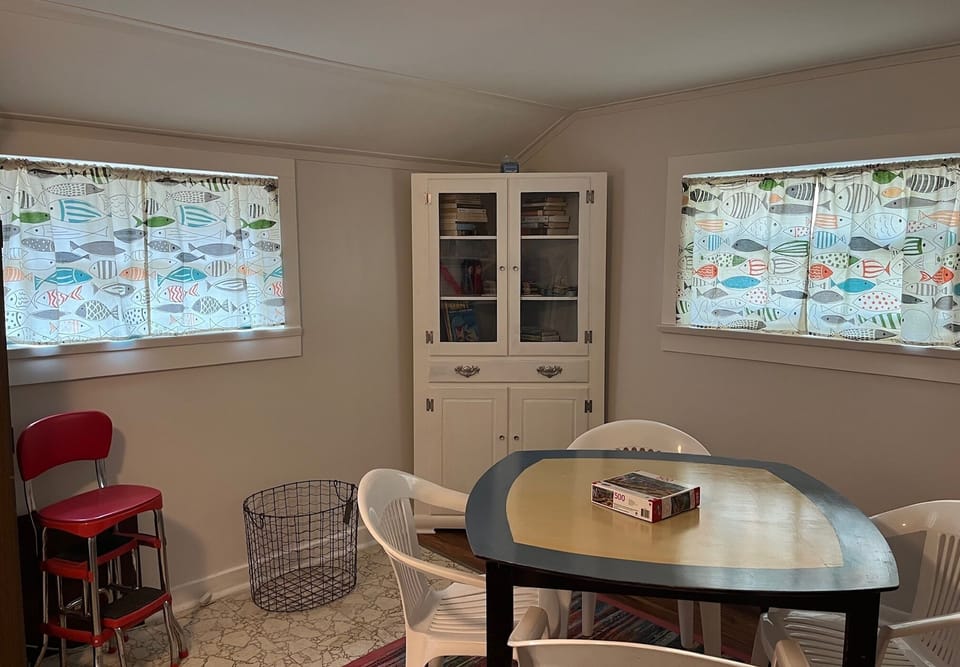 Game room area; puzzles, books, cards, and crayons.